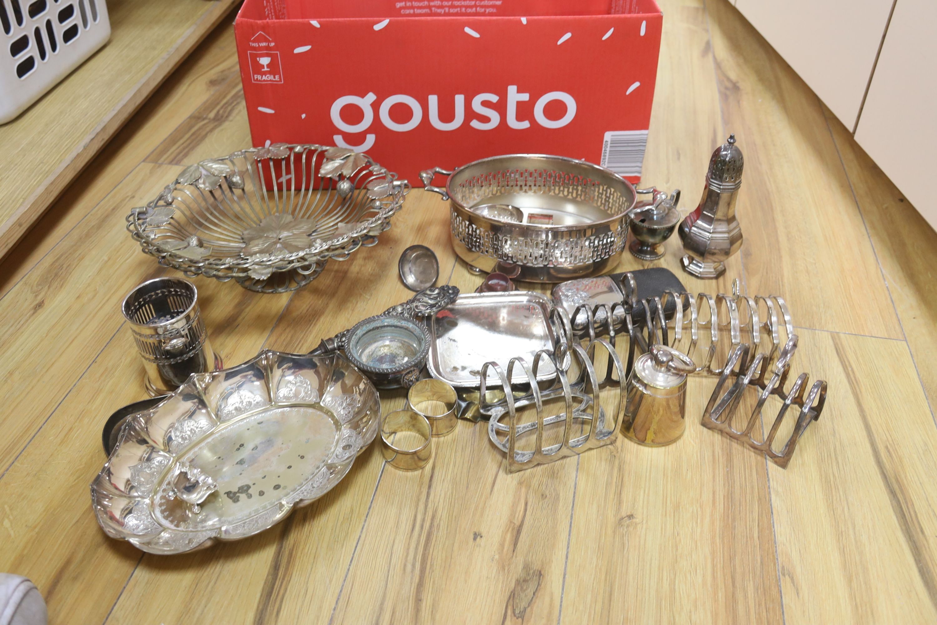 Mixed plated wares including wirework fruit basket, salts, toastracks, caster, etc.